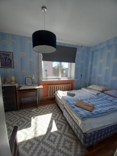 a bedroom with two beds and a window at Peatuspaik Paides in Paide
