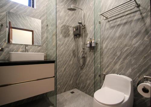 a bathroom with a shower and a toilet and a sink at Sunset Pool Villa Ao Nang Krabi in Ao Nang Beach