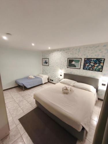 a hotel room with two beds in a bedroom at Casa 1941 in Conversano