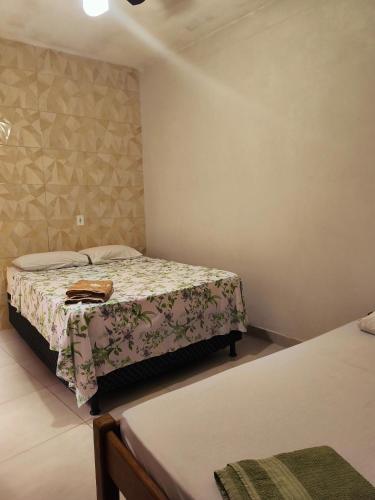 a bedroom with two beds in a room at Casa da Di in Lençóis