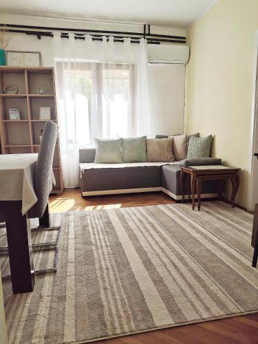 a living room with a couch and a table at Lana 38 in Savina
