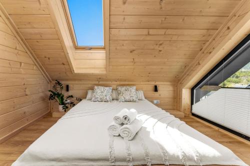 a bedroom with a bed with towels on it at Stasiówka in Sablówka