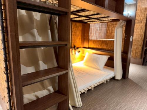 a couple of bunk beds in a room at ura San Jose in Okayama