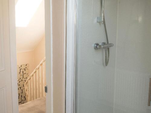 a door with a handle in a room at Buckie Central 2 bed Retreat 24 high street in Buckie