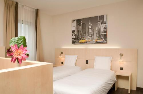 Postel nebo postele na pokoji v ubytování Ibis Styles La Louvière