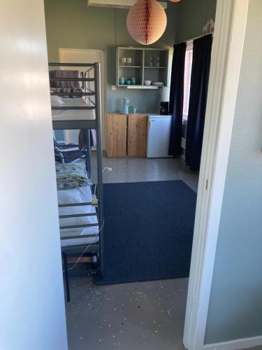 a view of a room with a kitchen and a room with a kitchen at Tängerdalens camping och café in Övertänger