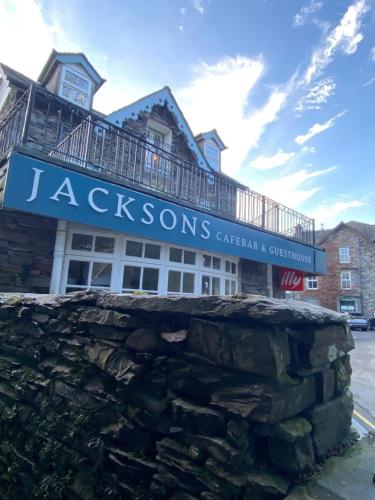 a sign for the jackson stones center and museum at Jacksons CafeBar & Guesthouse in Grasmere