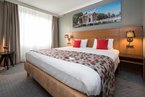 Bilderberg Grand Hotel Wientjesにあるベッド