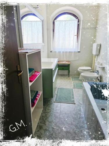 a bathroom with a sink and a toilet at Gioia Montedoro in Viareggio