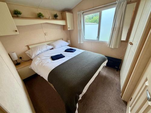 a bedroom with a bed in a small room at The Conwy Escape in Conwy
