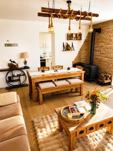 a living room with wooden furniture and a fireplace at Le Terrier- Chaleureux avec Jardin privatif et parking pour 2 voitures in Briançon