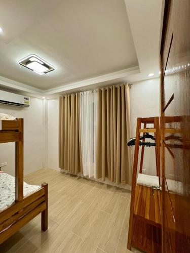 a room with a bed and a ladder in it at Arceo Homestay 2 Bedroom unit in Puerto Princesa City