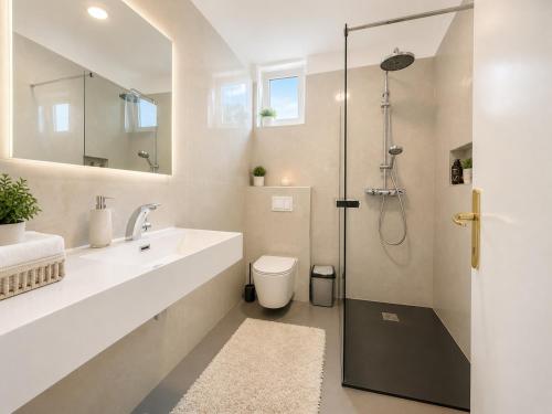a bathroom with a sink and a shower at New! Apartment Complex "S" in Čelina
