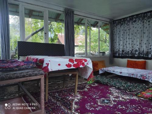 a room with a table with a cloth on it at Guesthouse Shakirbek in Arslanbob