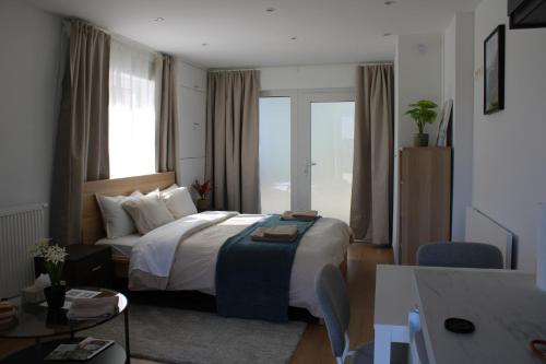 a hotel room with a bed and a large window at Aux Boutons d'Or in Namur