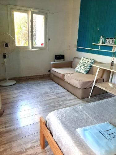 a living room with a couch and a table at Vecchia Casa en el centro in General Villegas