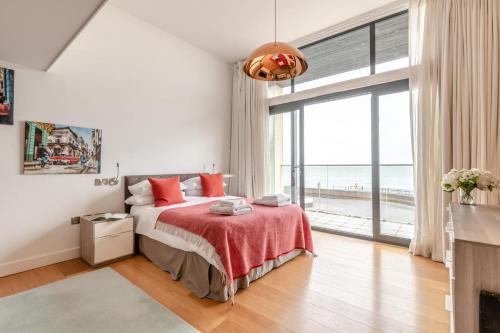 a bedroom with a bed and a large window at 4 Bed in Hythe oc-p30519 in Hythe