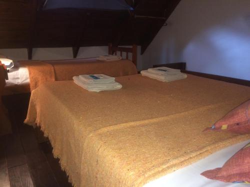 Katil atau katil-katil dalam bilik di Hotel y Cabañas Las Marías