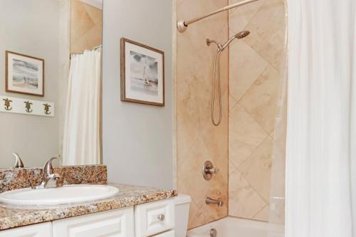 a bathroom with a sink and a shower at Dunes Club 2A by Pristine Properties Vacation Rentals in Cape San Blas