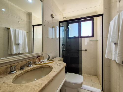 a bathroom with a sink and a toilet and a shower at Apartment 116 - Jundiaí in Jundiaí