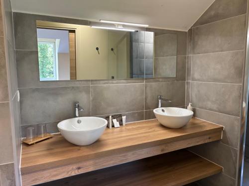 two sinks on a wooden counter in a bathroom at Villa Le Touquet, piscine privée, 4 chambres in Le Touquet-Paris-Plage