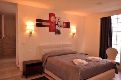 Un pat sau paturi într-o cameră la Agrihotel Croce Vallone