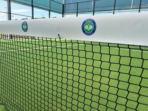a tennis net on a tennis court at Lion Cottage - Dog-Friendly 3-Bed in Heart of Holt in Holt