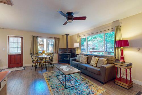 a living room with a couch and a table at Casa Tahquitz in Idyllwild