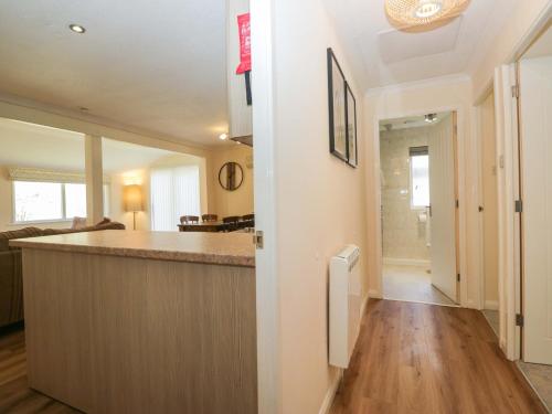 a kitchen with a large island in a room at Beech Timber Lodge in Keswick