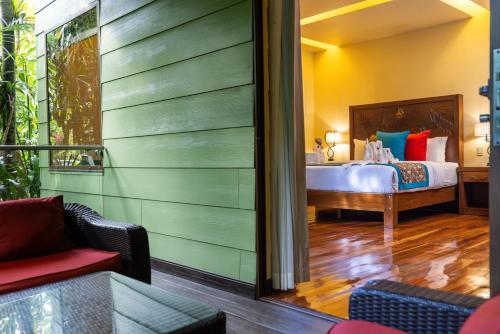 a bedroom with a bed in a room at Baldi Hot Springs Hotel & Spa in Fortuna