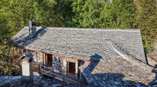 an old roof of a house in the woods at Hostelleria in Linescio