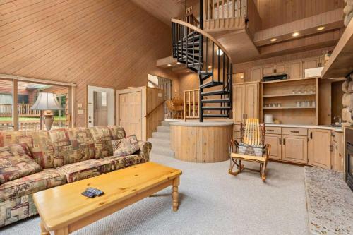 a living room with a couch and a table at Causeway On Gull - 2 Bedroom in Nisswa