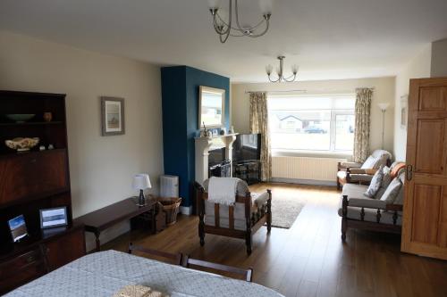 a living room with a couch and a fireplace at Avalon in Bundoran