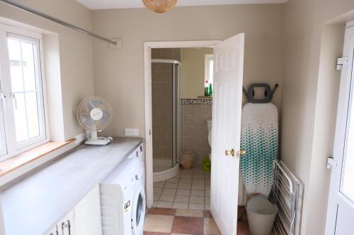 a bathroom with a sink and a shower at Avalon in Bundoran