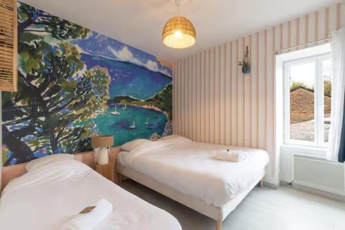 a bedroom with two beds and a painting on the wall at On dirait le Sud - Proche Mâcon SOLEIDOR in Mâcon