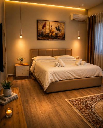 Llit o llits en una habitació de Adora Apartment