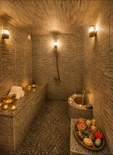 a bathroom with a tub and a sink and a toilet at RIAD YOUSSEF in Fez