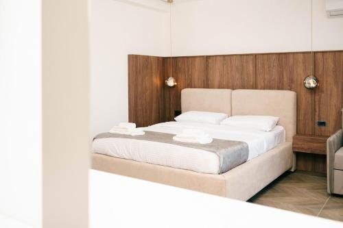a bedroom with a bed and a mirror at Boutique Hotel Zara in Ulcinj
