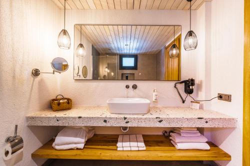 a bathroom with a sink and a mirror at The Pearl Ölüdeniz in Oludeniz