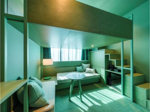 a bedroom with a loft bed with a desk at toggle hotel suidobashi - Vacation STAY 13415v in Tokyo
