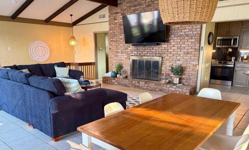 a living room with a blue couch and a table at Lakeview Lookout in Tool