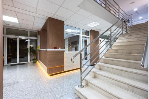 a lobby of a building with a staircase at Hotel Podostrog - New Comfort 2026 in Budva
