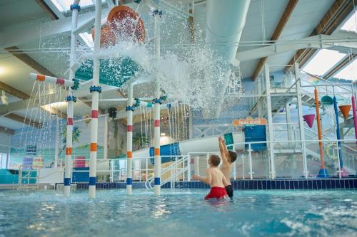 a young child playing in a water park at Sunrise in Selsey