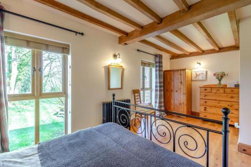 a bedroom with a bed and a large window at 2 Bed in Dorchester oc-dc075 in Charminster