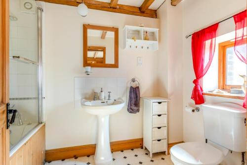 a bathroom with a sink and a toilet and a shower at 2 Bed in Dorchester oc-dc075 in Charminster