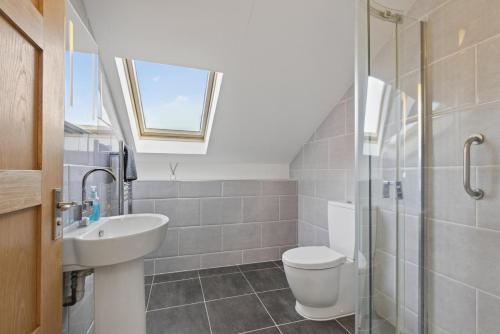 a bathroom with a sink and a toilet and a shower at 2 Bed in Beaminster oc-63047 in Broadwindsor