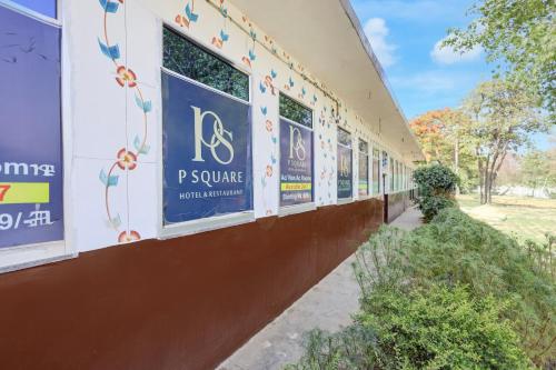 a building with signs on the side of it at Hotel O S.R GRAND HOTEL & RESTAURANT in Kānpur