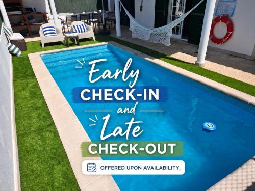 a sign by a swimming pool with the words early check in and late check out at Meco Beach and Private Pool Villa in Sesimbra