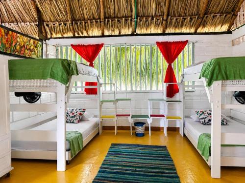 a room with two bunk beds and a window at Antara del Mar in San Bernardo del Viento