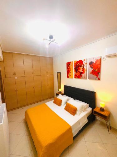 a bedroom with a large bed in a room at Blue Port Beach House in Rafina